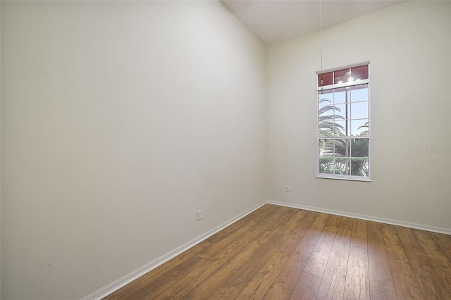 spare room with hardwood / wood-style flooring