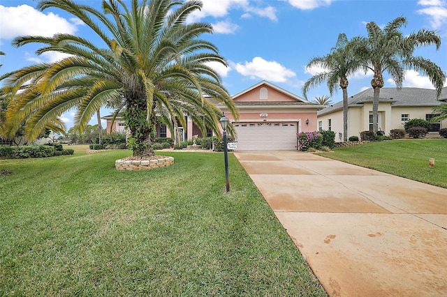 view of front of property with a front yard and a garage