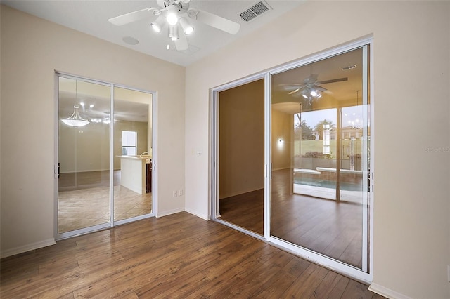 unfurnished bedroom featuring hardwood / wood-style floors and ceiling fan