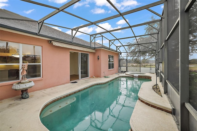 view of pool with glass enclosure, an in ground hot tub, and a patio area