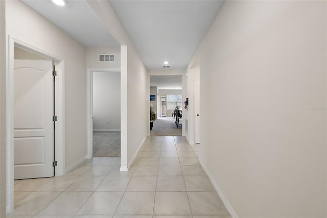 hall with light tile patterned flooring