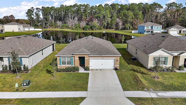 birds eye view of property with a water view