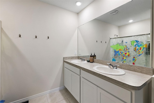 bathroom with vanity, a shower with shower curtain, and tile patterned floors