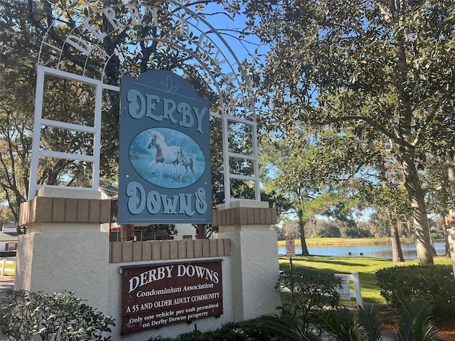 community sign with a water view