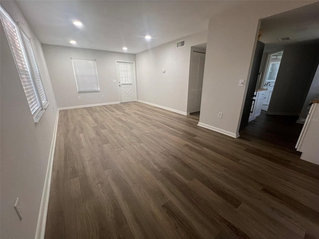 spare room with dark hardwood / wood-style flooring