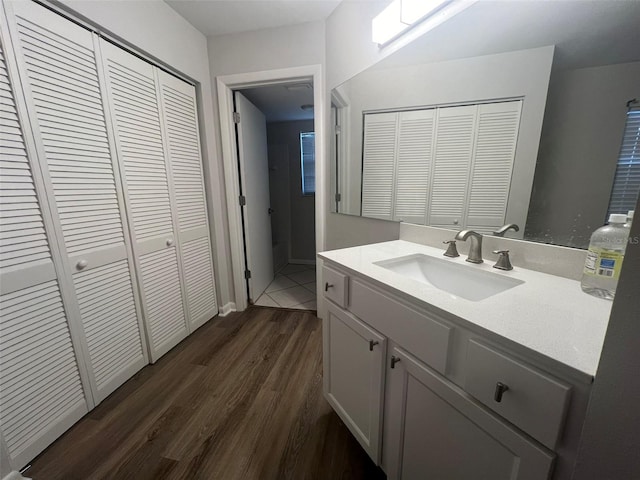 bathroom with wood-type flooring and vanity