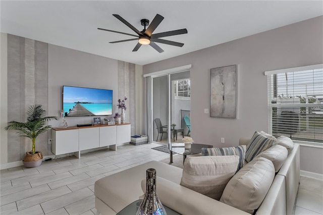 living room with light tile patterned floors and ceiling fan