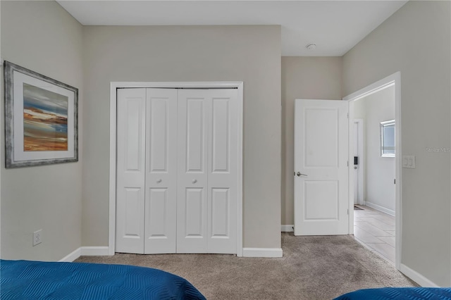 unfurnished bedroom with carpet and a closet