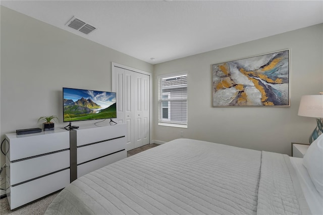 carpeted bedroom featuring a closet