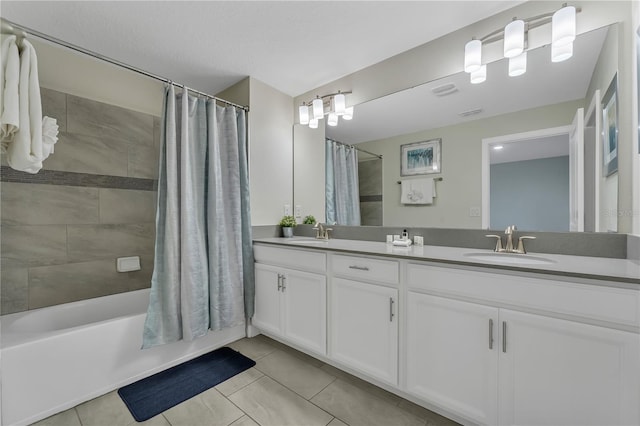 bathroom with shower / bath combination with curtain, vanity, and tile patterned floors