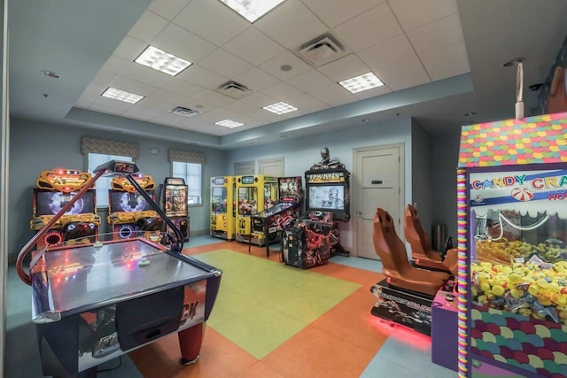 playroom featuring a paneled ceiling