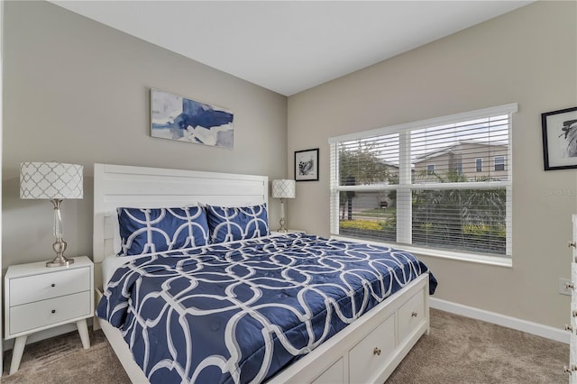 bedroom featuring light carpet