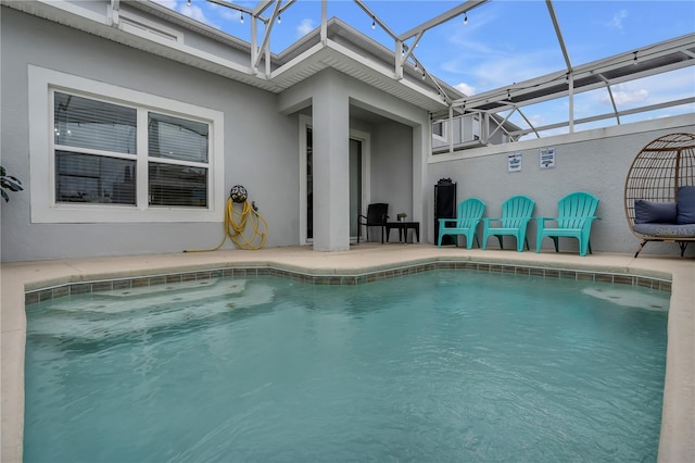 view of pool with a lanai and a patio area