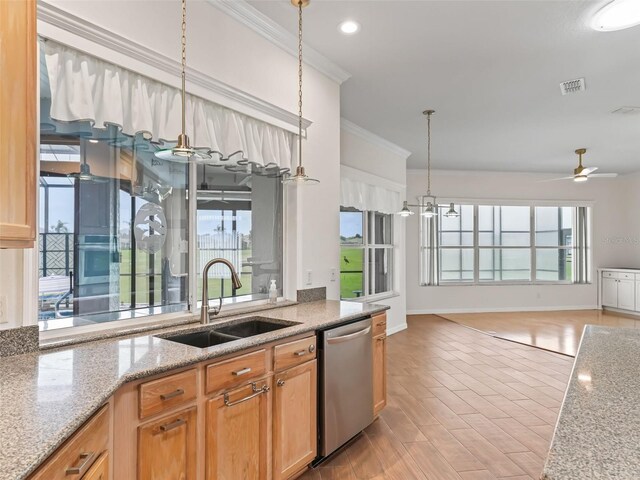 kitchen featuring light stone counters, stainless steel dishwasher, ceiling fan with notable chandelier, sink, and light hardwood / wood-style flooring