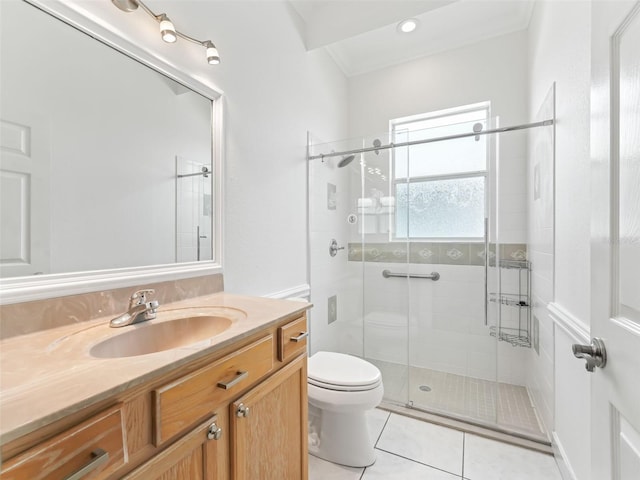 bathroom with tile patterned floors, walk in shower, vanity, and toilet