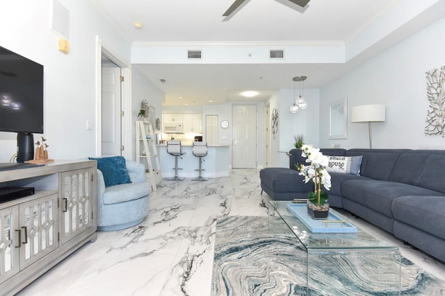 living room featuring crown molding, ceiling fan with notable chandelier, and light tile floors