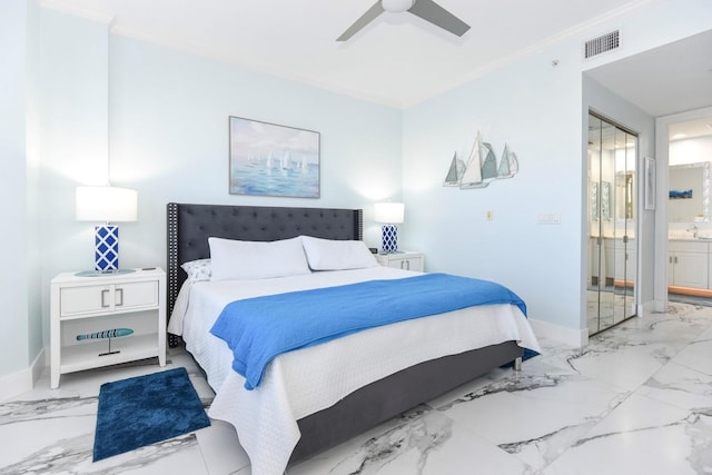 bedroom featuring crown molding, ceiling fan, ensuite bathroom, and light tile floors