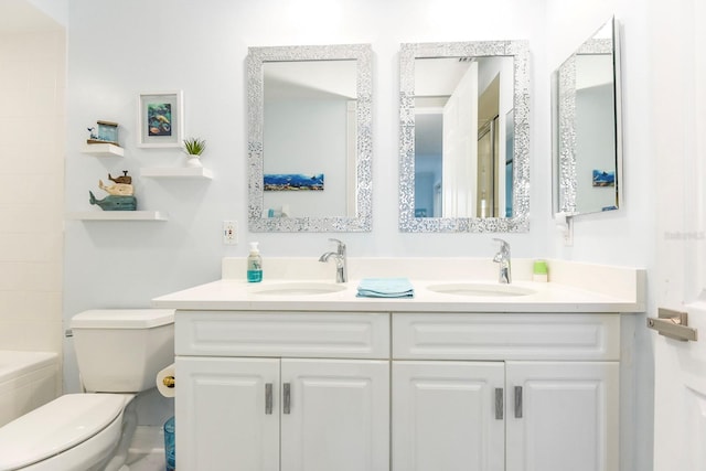 bathroom with toilet and double vanity