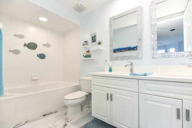 full bathroom featuring tile flooring, vanity with extensive cabinet space, toilet, and tiled shower / bath