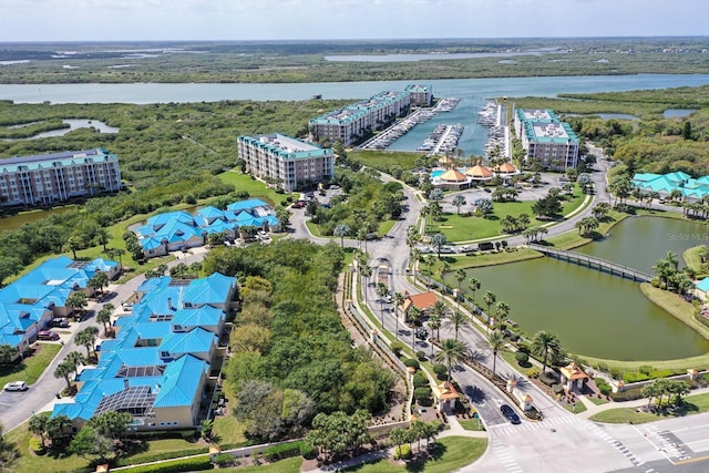 birds eye view of property featuring a water view