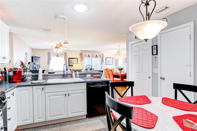 kitchen with decorative light fixtures, white cabinets, sink, and dishwasher