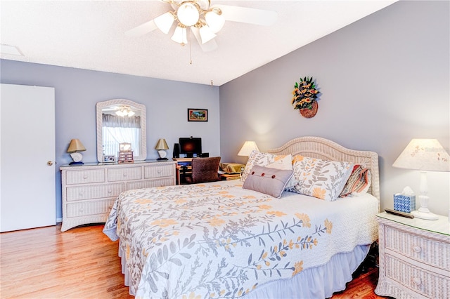 bedroom featuring ceiling fan and light wood-type flooring