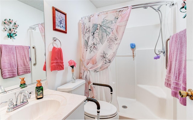 bathroom featuring vanity, a shower with shower curtain, and toilet