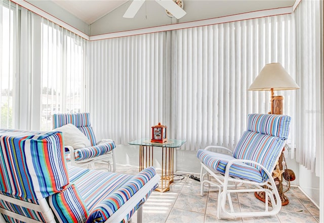 sunroom featuring ceiling fan and lofted ceiling