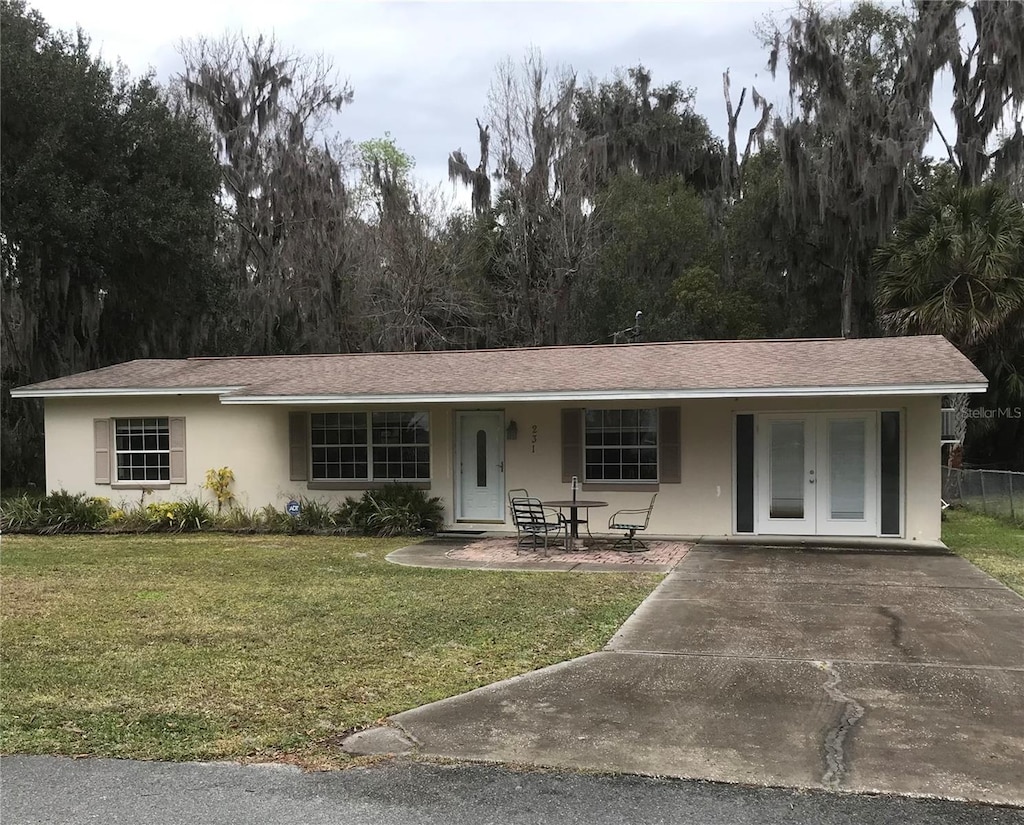 ranch-style house with a front lawn