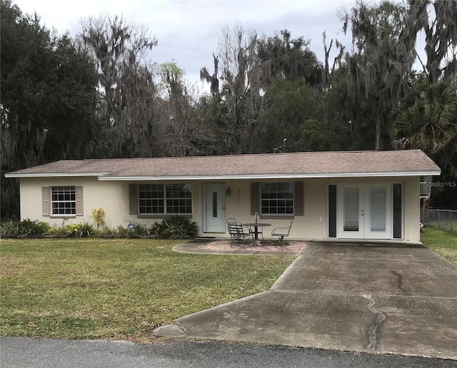 ranch-style house with a front lawn