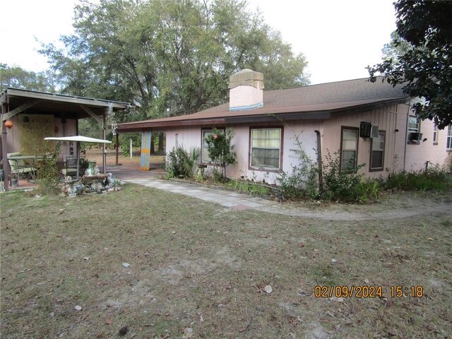 rear view of house with a patio area