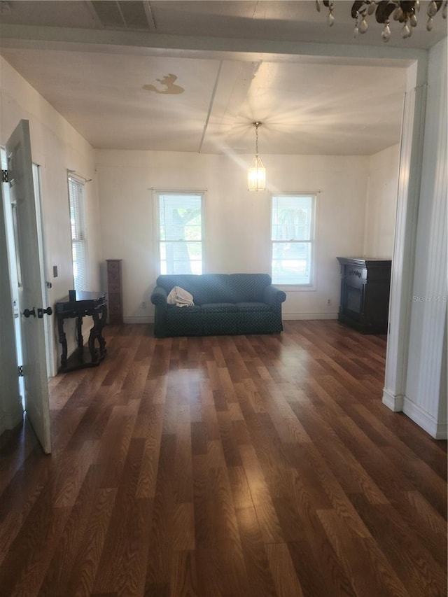 unfurnished living room featuring dark hardwood / wood-style flooring