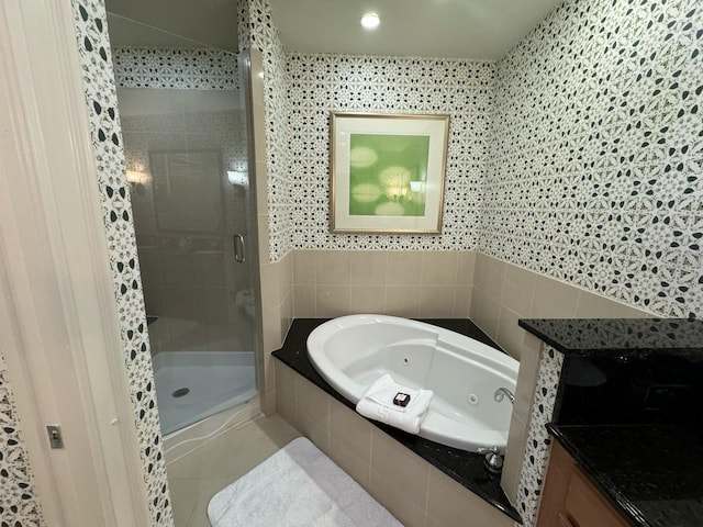 bathroom with shower with separate bathtub, tile flooring, and vanity