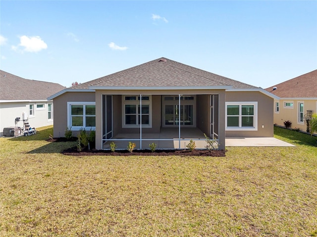 back of house with a lawn and a patio area