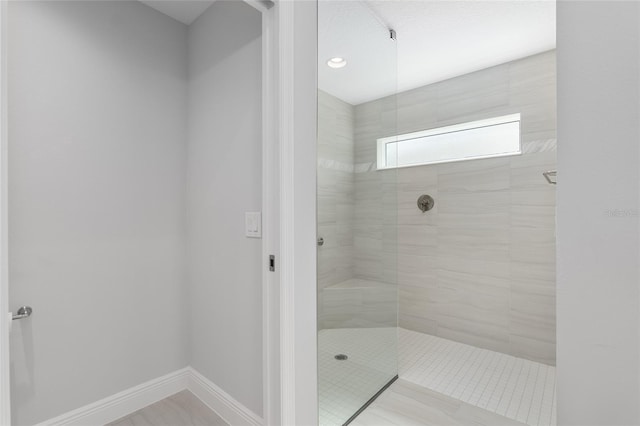 bathroom featuring tiled shower