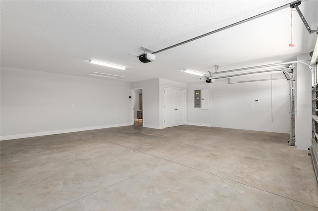 garage featuring electric panel and a garage door opener