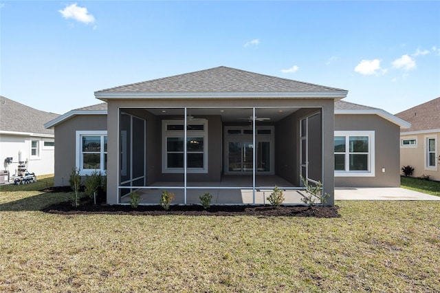 rear view of house with a patio area and a lawn