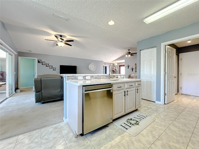 kitchen with light tile floors, ceiling fan, and dishwasher