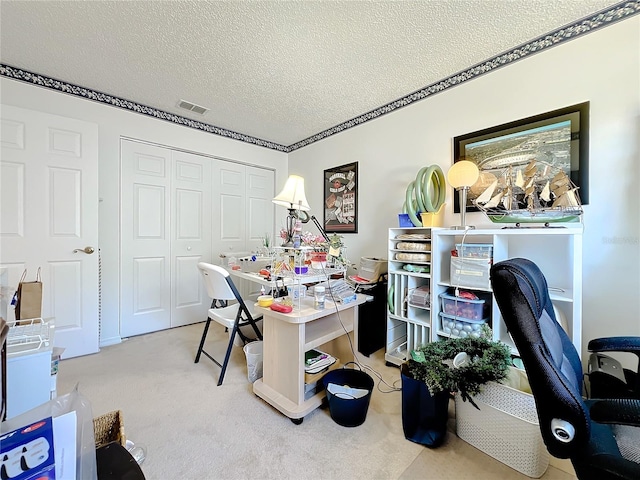 office area with light carpet, a textured ceiling, and ornamental molding