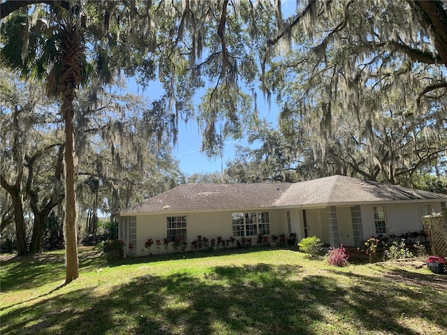 rear view of house with a lawn