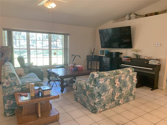 living room featuring light tile floors, lofted ceiling, and ceiling fan