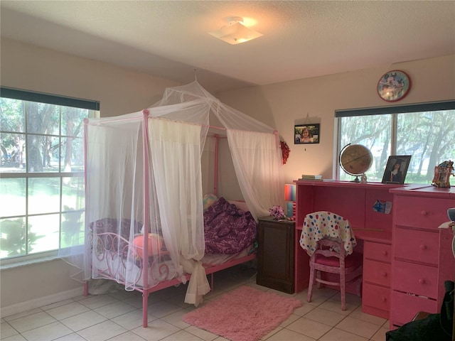 tiled bedroom with multiple windows