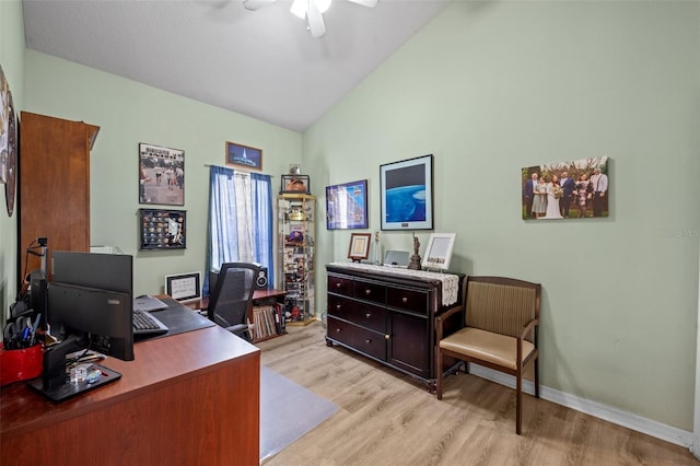 office with vaulted ceiling, ceiling fan, and light wood-type flooring