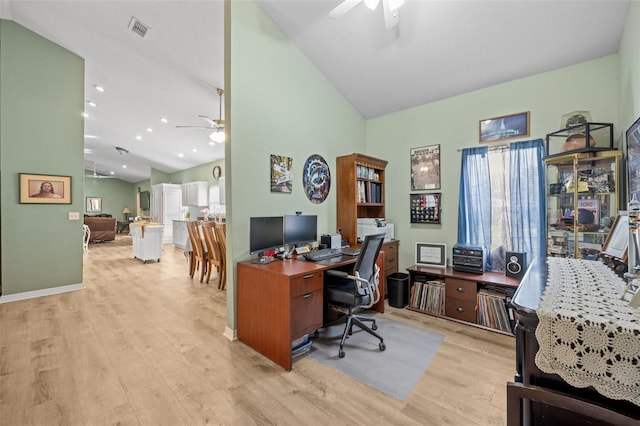 office area with high vaulted ceiling, light hardwood / wood-style floors, and ceiling fan