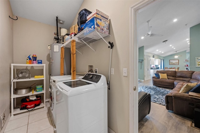 clothes washing area with independent washer and dryer, water heater, ceiling fan, and hookup for a washing machine