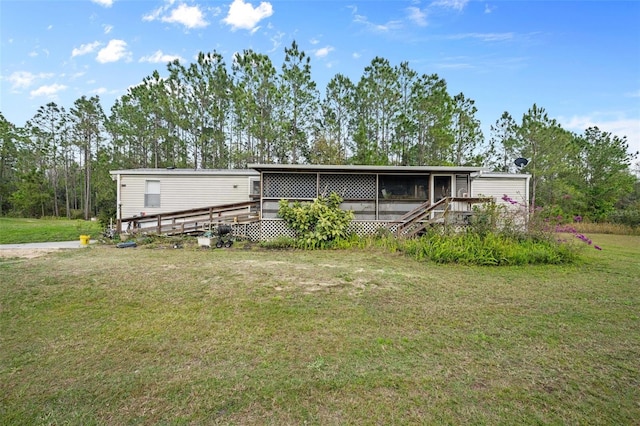 exterior space featuring a wooden deck and a front lawn