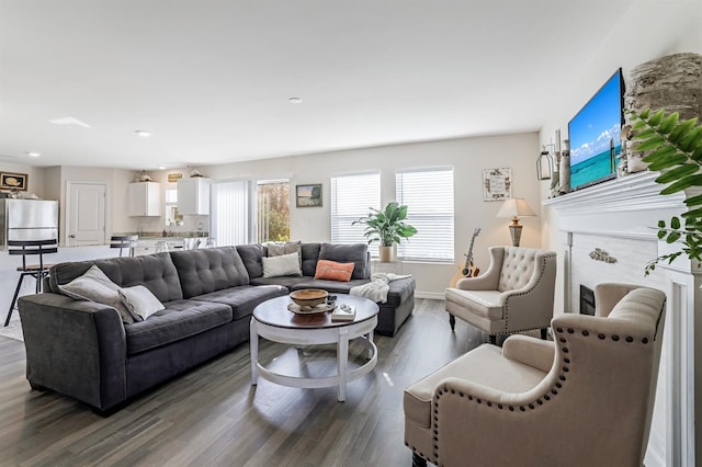 living room featuring dark wood-style floors and baseboards