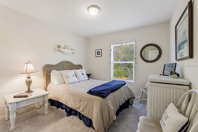 carpeted bedroom featuring baseboards