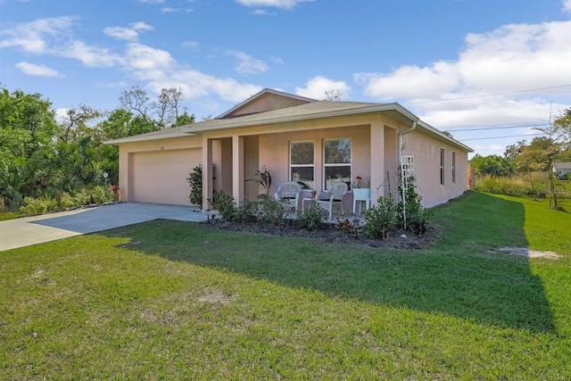 view of front of house featuring a garage and a front lawn