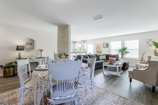 dining space featuring hardwood / wood-style floors